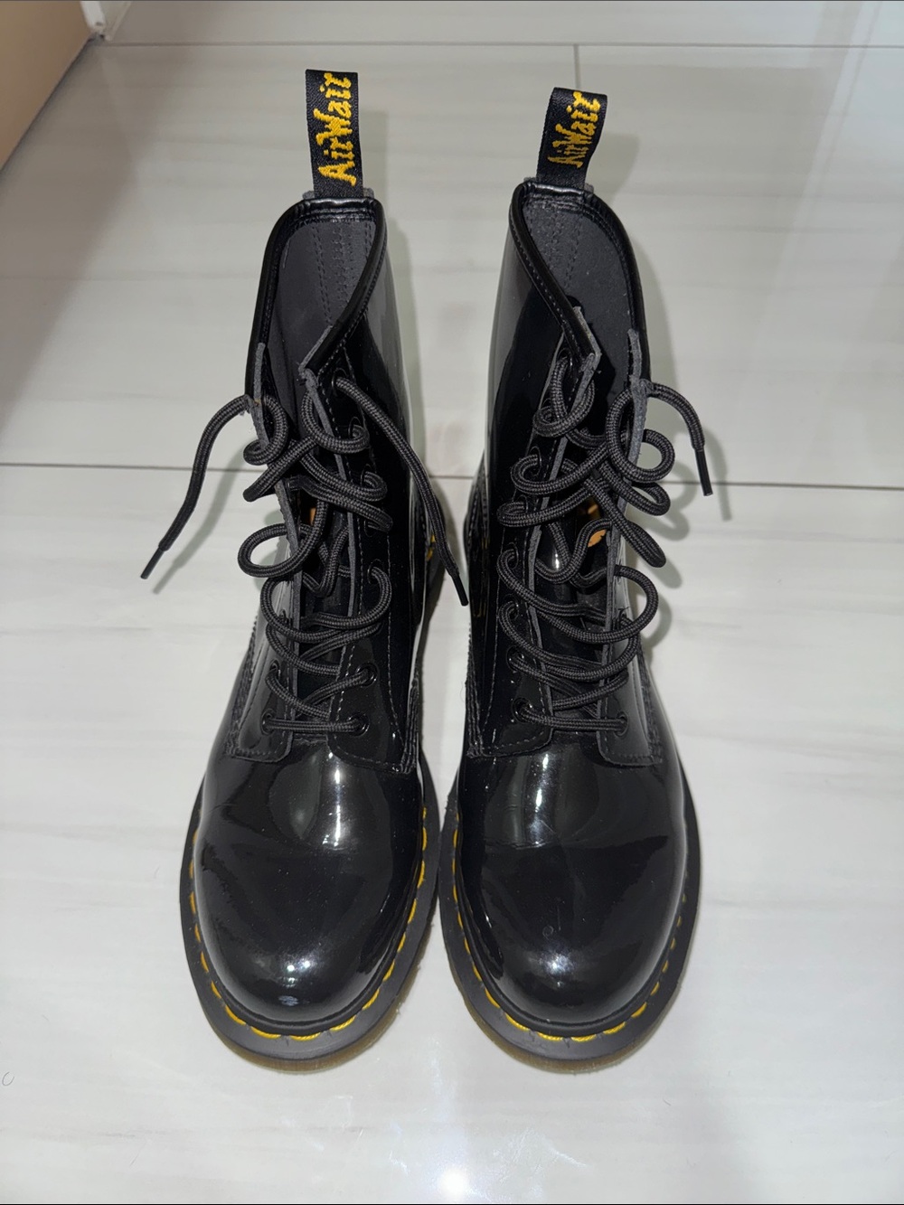 Dr. Martens Black Patent Lace-Up Boots with Yellow Stitching